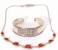 Mixed Lot: white metal torc bangle stamped 925, together with a modern amber necklace stamped 925 (