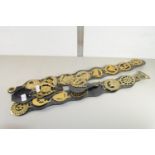 COLLECTION OF HORSE BRASSES ON LEATHER STRAPS