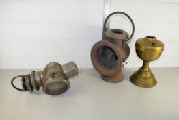 BOX CONTAINING BRASS OIL LAMP AND TWO VINTAGE MOTORING LAMPS