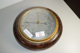 BAROMETER IN CIRCULAR OAK FRAME AND A FURTHER SMALL TEMPERATURE GAUGE IN CIRCULAR WOODEN FRAME