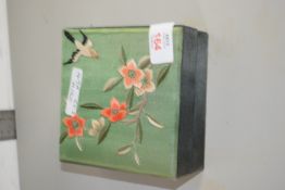 BOX CONTAINING PAINTED DRAUGHT PIECES