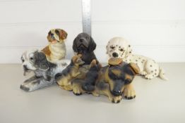 GROUP OF MODEL DOGS AND A MODEL OF A DOG WITH PUPPIES