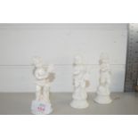 THREE WHITE GLAZED CERAMIC MODELS OF MUSICIANS