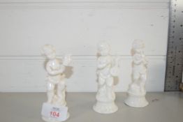 THREE WHITE GLAZED CERAMIC MODELS OF MUSICIANS