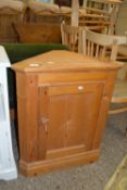 SMALL LOW VARNISHED PINE CORNER CABINET, WIDTH APPROX 63CM MAX