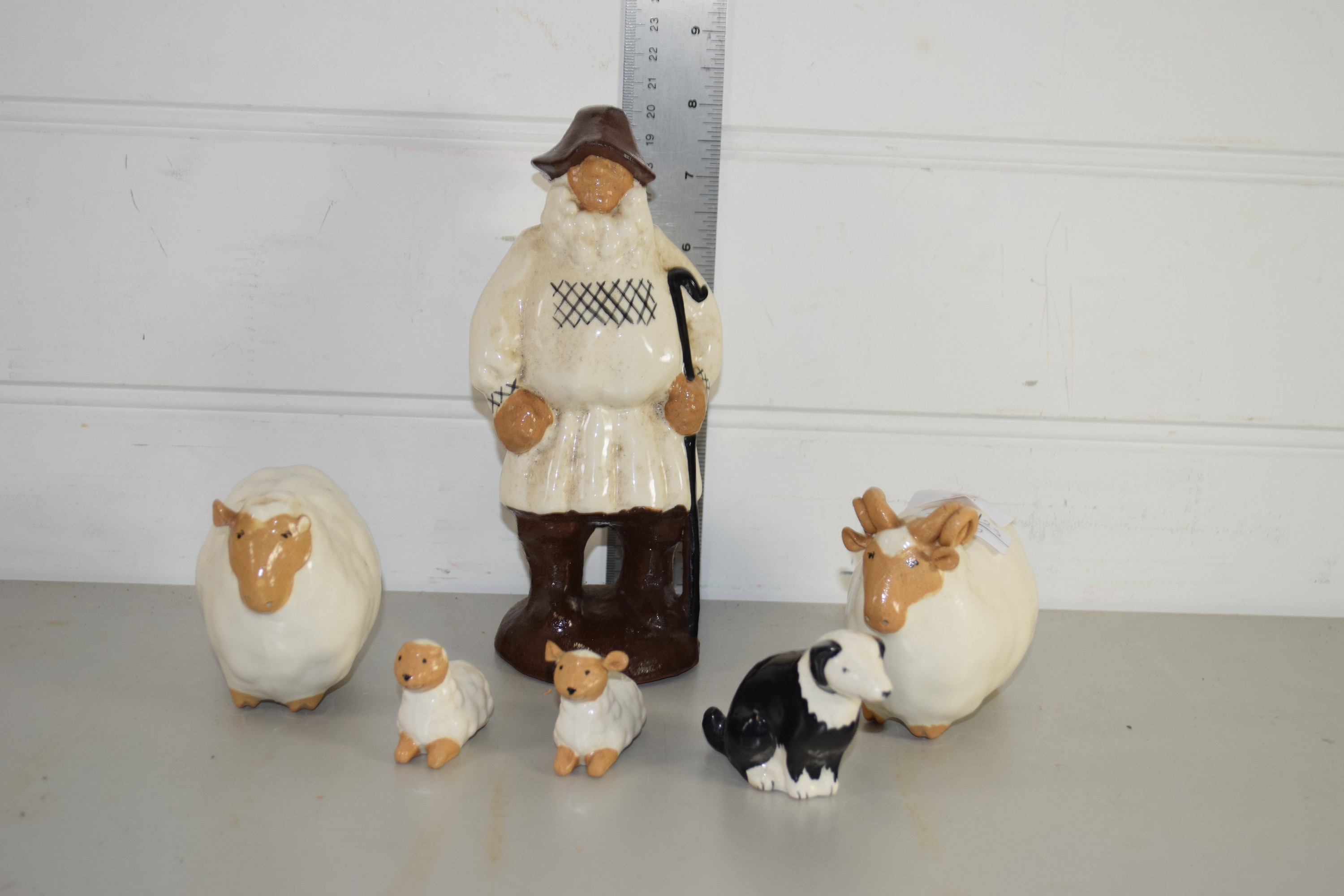 POTTERY MODEL OF A SHEPHERD TOGETHER WITH TWO SHEEP AND SHEEP DOG