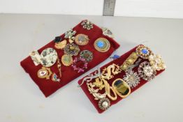 TWO TRAYS CONTAINING COSTUME JEWELLERY AND BADGGES