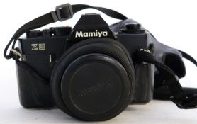 Mamiya ZE film camera together with a Mamiya-Sekore 50mm lens plus case