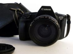 Canon EOS 650 film camera together with Canon zoom lens EF35-70mm lens