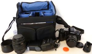 Sigma SA-300 film camera together with Sigma UC Zoom 70-210mm lens, flash and fitted case