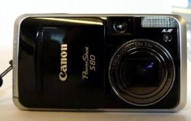 Canon Powershot S80 together with case and charger