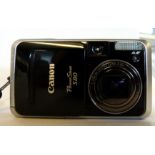 Canon Powershot S80 together with case and charger