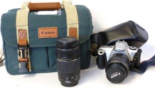 Canon EOS 300 film camera together with Canon zoom lens EF28-105mm lens and Canon zoom lens EF75-