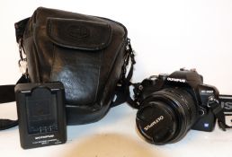 Olympus E-400 digital camera together with Zuiko digital 17.5-45mm lens, battery charger and case