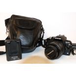 Olympus E-400 digital camera together with Zuiko digital 17.5-45mm lens, battery charger and case