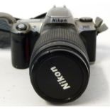 Nikon F65 film camera together with Nikon Nikkor 70-300mm lens