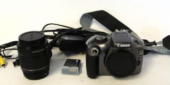 Canon EOS 1100D digital camera together with Canon EFS 18-55mm lens and charger