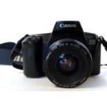Canon EOS 1000F film camera together with Canon zoom lens EF35-80mm