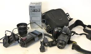 Nikon D40 digital camera with a Nikkor 18-55mm lens, an AF-SNikkor 35mm lens, flash, case, charger