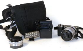 Sony Nex-5N digital camera together with Sony 18-55mm lens, Sony E2.8/16 lens plus accessories in