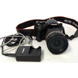 Canon EOS 1000D digital camera together with Tamron 18-270mm lens plus charger