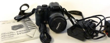 Fujifilm S9500 digital camera together with Fujinon 28-300mm lens and accessories