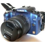 Lumix G2 digital camera together with Lumix 14-42mm lens, charger and fitted case