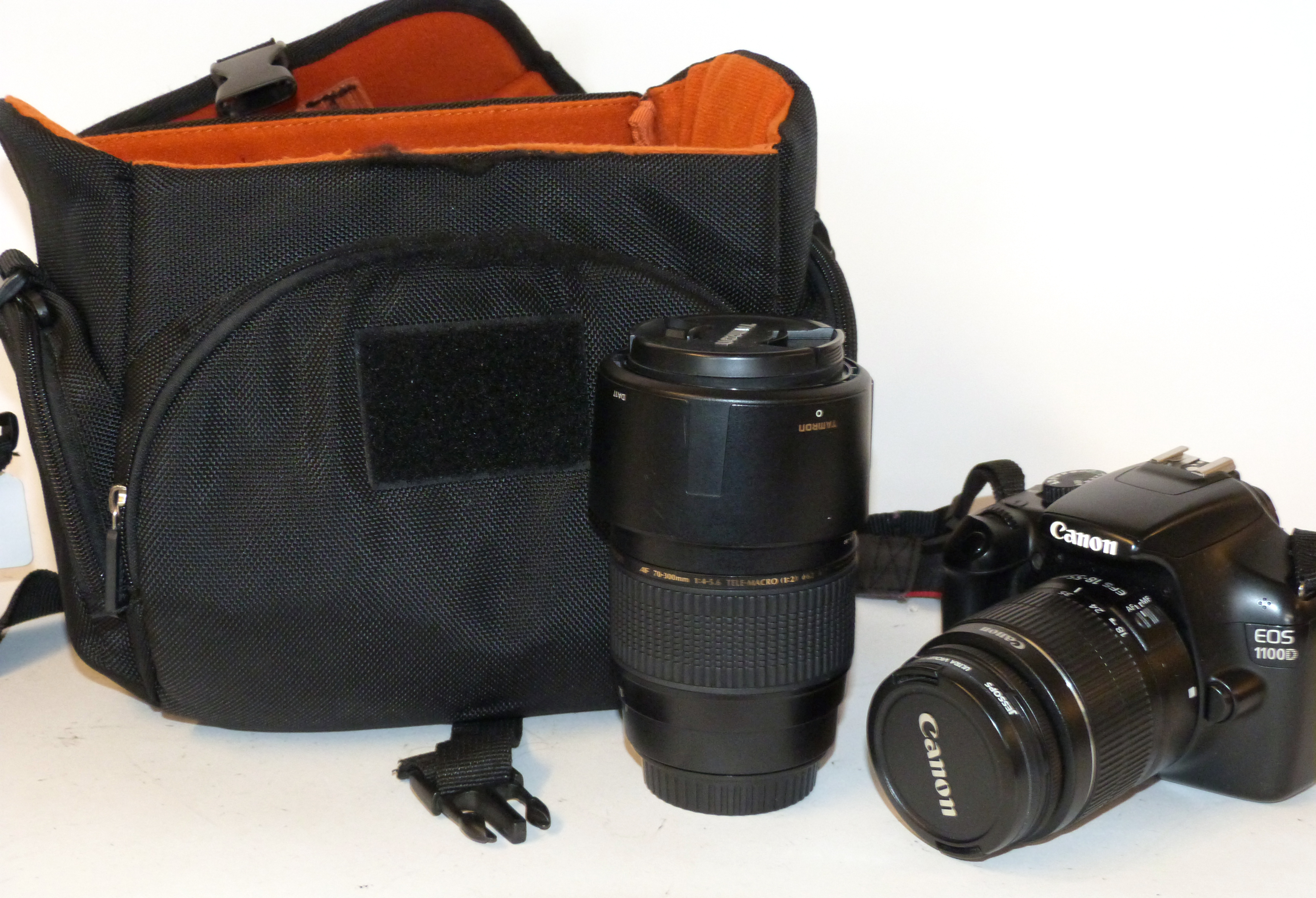 Canon EOS 1100 D digital camera together with Canon zoom lens EF-S 18-55mm, Tamron AF 70-300mm lens,