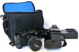 Canon EOS D60 digital camera together with Canon zoom lens EF24-85mm, Canon power adapter and