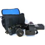 Canon EOS D60 digital camera together with Canon zoom lens EF24-85mm, Canon power adapter and