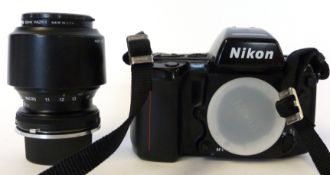Nikon F90 film camera, together with Tamron 70-210mm lens