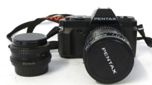 Pentax P30M with Pentax A zoom 28-80mm lens + Cosinon S 50mm lens