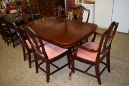 MAHOGANY EFFECT REPRODUCTION TWIN PEDESTAL EXTENDING DINING TABLE WITH INSET STRUNG DECORATION,