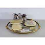 SMALL GILT TRAY WITH VARIOUS ITEMS, HAIR BRUSHES, PLATED SPOON, JUG, SMALL TANKARD ETC