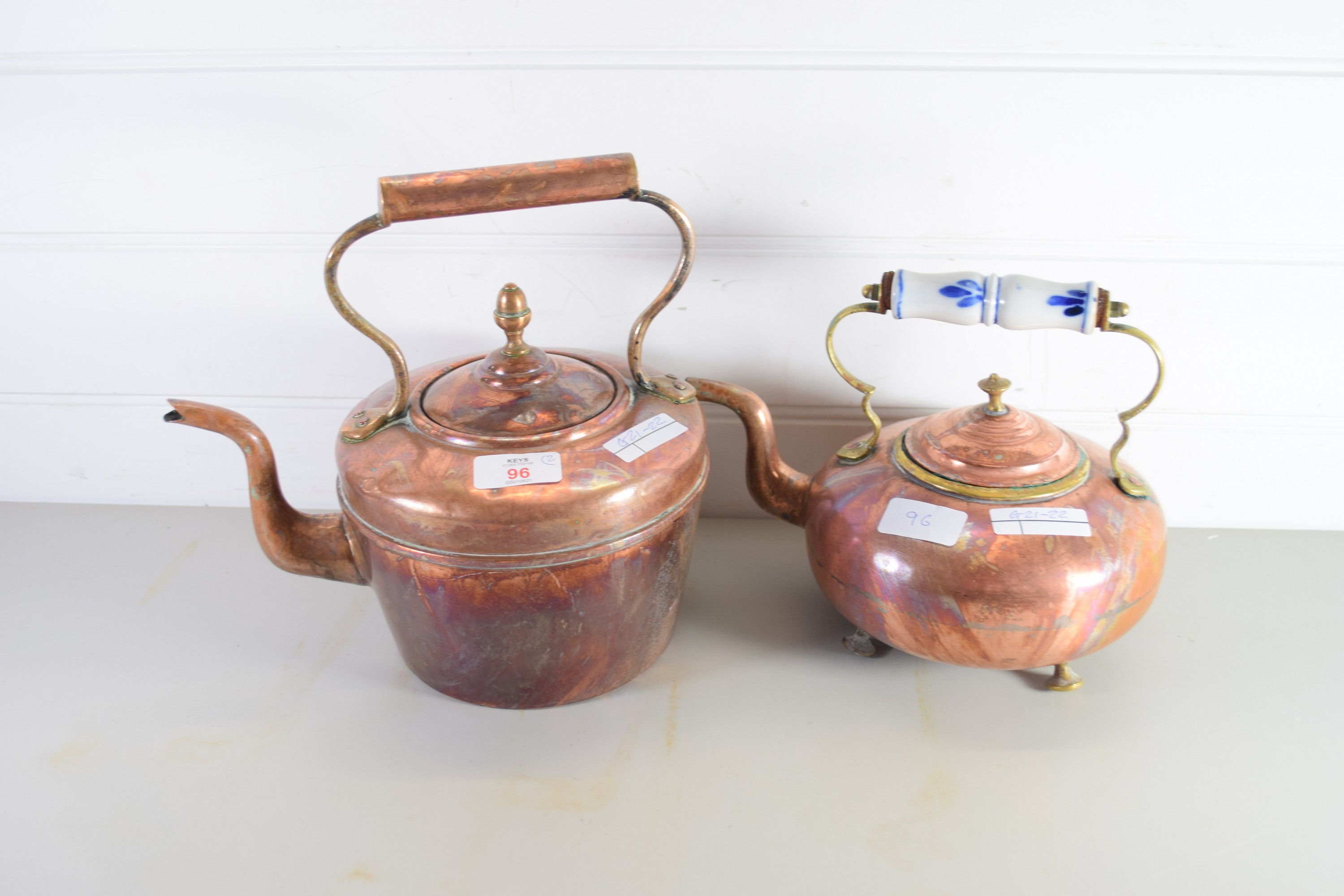 TWO COPPER KETTLES, ONE WITH CERAMIC HANDLE