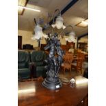LARGE AND IMPRESSIVE CAST TABLE LAMP FORMED AS TWO CHERUBS WITH FOLIATE DECORATION AND TRIPLE