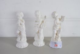 THREE SMALL CERAMIC WHITE GLAZED FIGURES OF CHERUB MUSICIANS