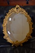 WALL MIRROR WITH ORNATE GILT SURROUND, APPROX 65 X 48CM MAX