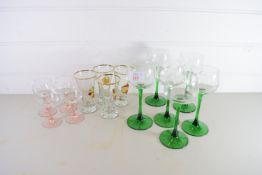 SET OF SIX WINE GLASSES WITH GREEN STEMS, TOGETHER WITH OTHER GLASSES