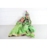 TWO PUPPETS IN GREEN DRESS