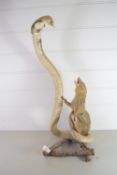 MODEL OF A MONGOOSE WITH COBRA