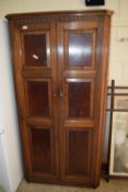 ARTS & CRAFTS STYLE OAK WARDROBE WITH PANELLED DOORS AND CARVED FRIEZE, WIDTH APPROX 95CM MAX