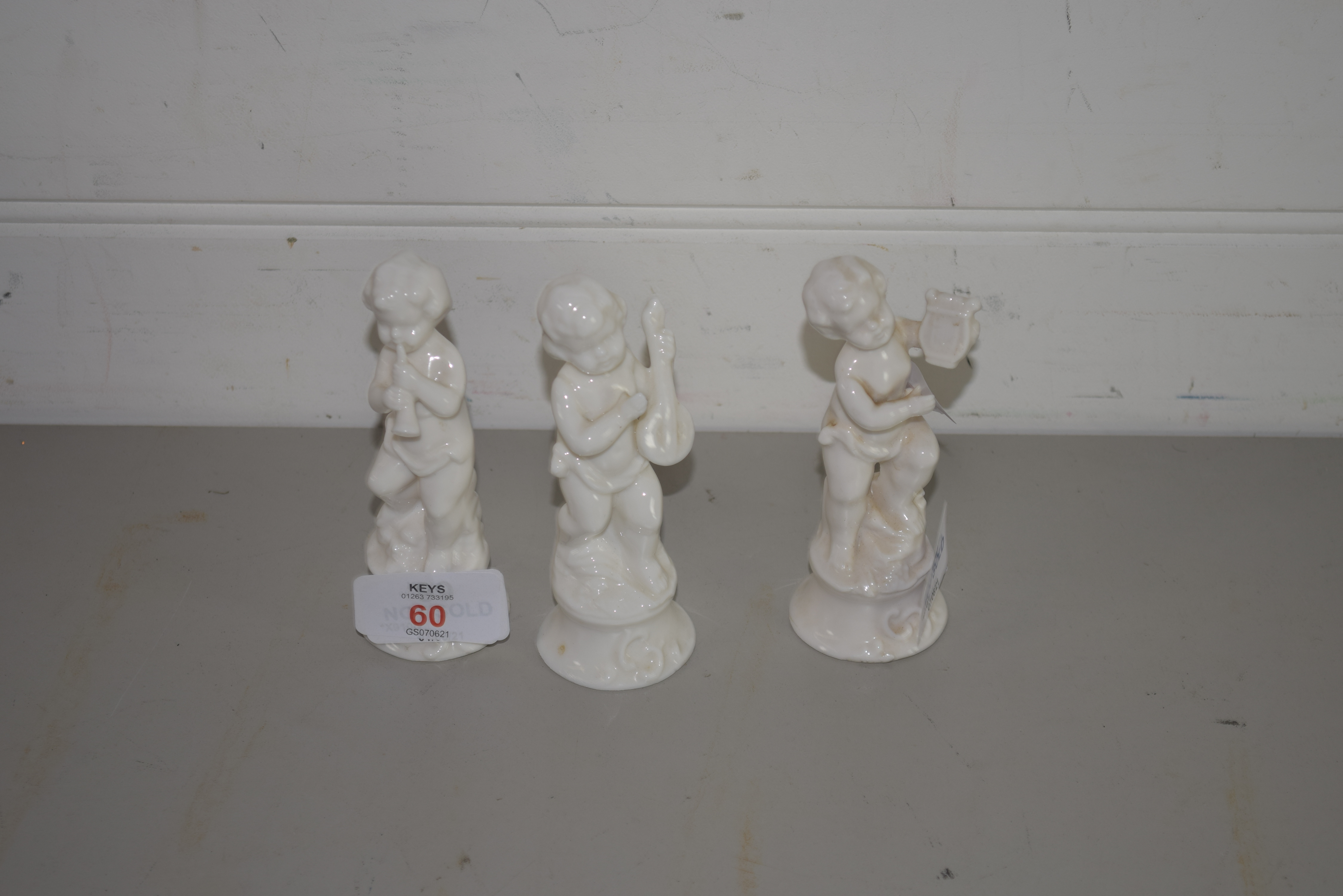 THREE SMALL WHITE GLAZED CERAMIC FIGURES