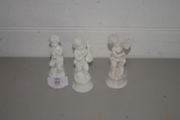 THREE SMALL WHITE GLAZED CERAMIC FIGURES