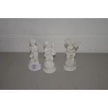 THREE SMALL WHITE GLAZED CERAMIC FIGURES