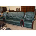 THREE PIECE LEATHER UPHOLSTERED SUITE COMPRISING RECLINER CHAIR, ARMCHAIR AND THREE SEAT SOFA, THE