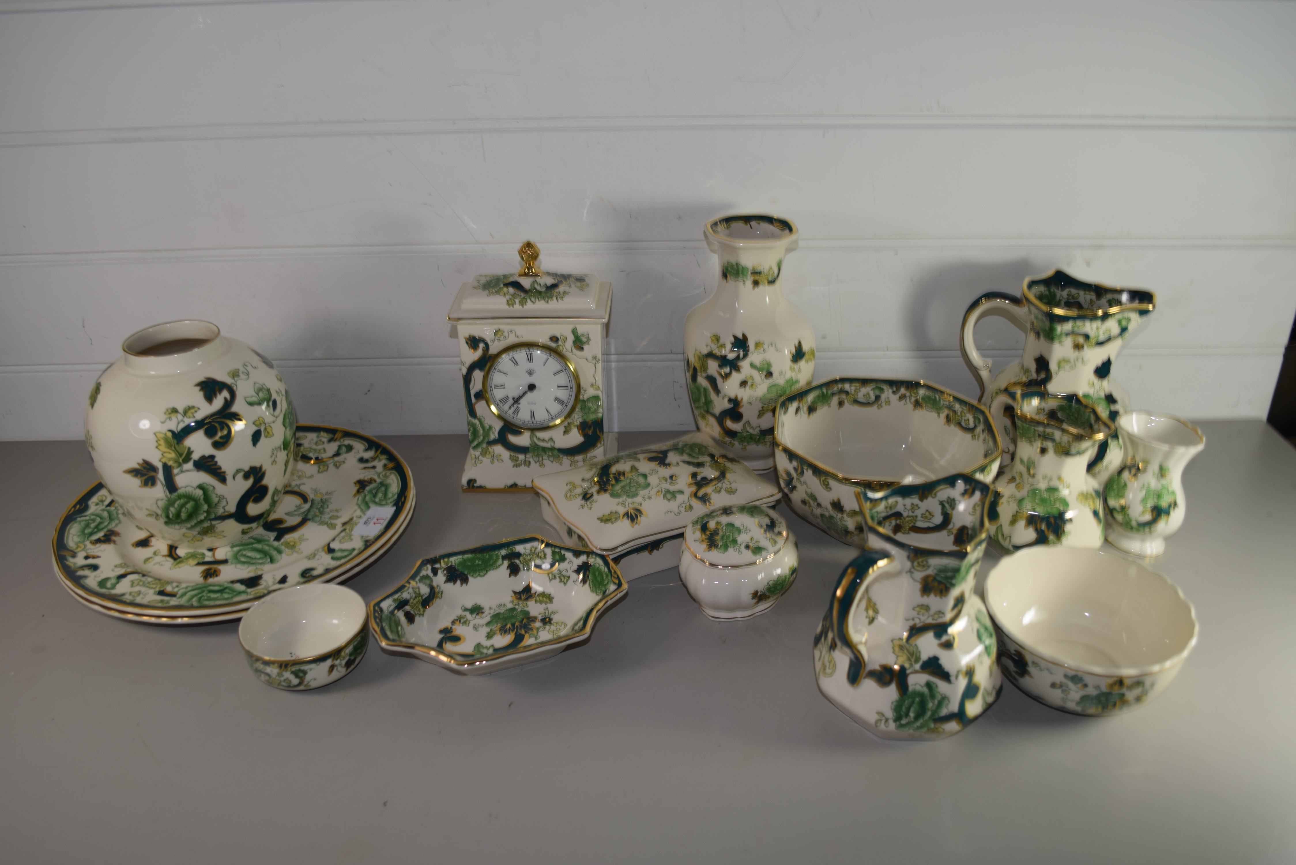 QUANTITY OF MASONS CHARTREUSE PATTERN COMPRISING MANTEL CLOCK, JUGS AND VASES AND PIN DISHES