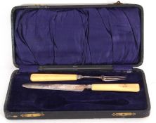 George III fruit knife and fork, each with carved ivory angular handles, the blades Birmingham 1809,