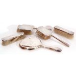 Matching silver backed dressing table wares to include two hairbrushes and two clothes brushes,