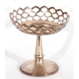 George V silver pedestal dish, the circular pierced bowl on a tapering plain stem and spreading